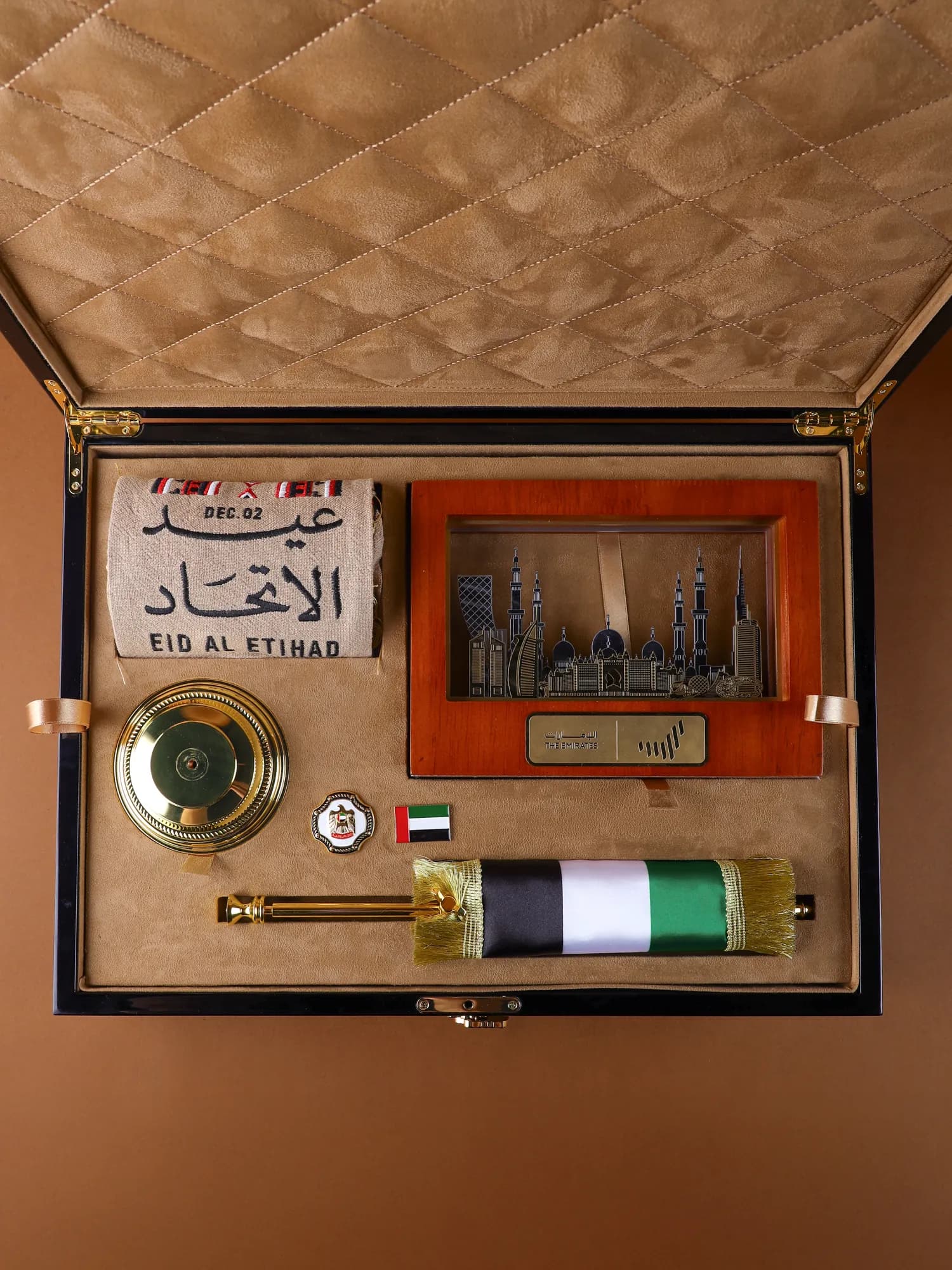 The VIP wooden box open, its contents set in a stitched lining